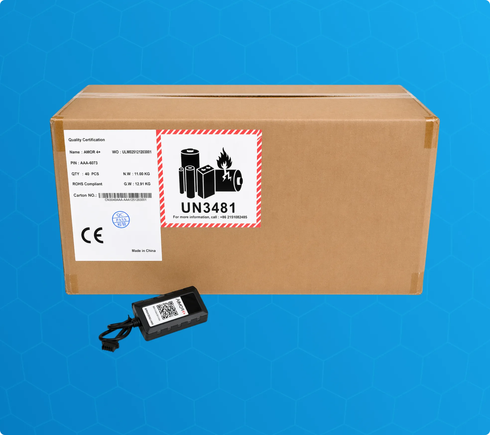 A single black Armor™ 4+ telematics tracking base unit shown next to a bulk master shipping carton labeled UN3481.