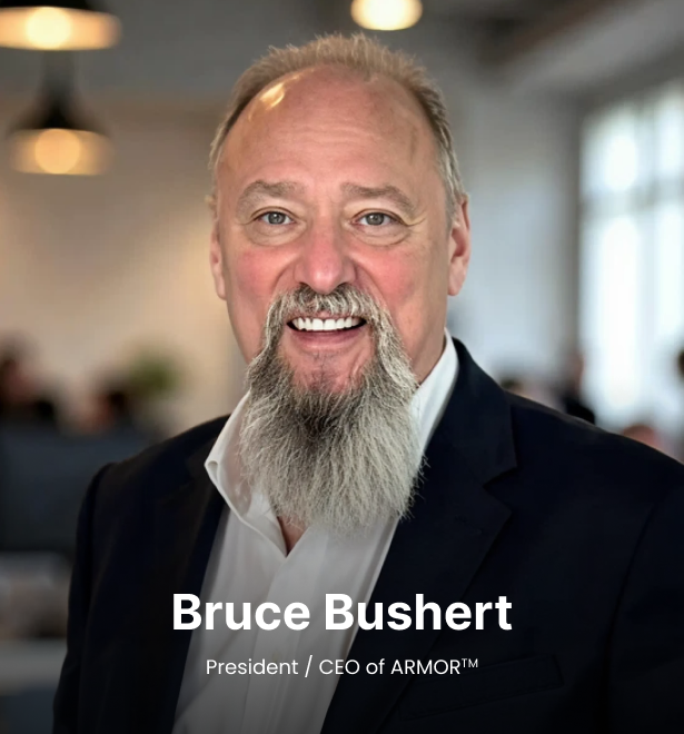 Portrait of Bruce Bushert, President and CEO of ARMOR™, smiling in a professional setting.