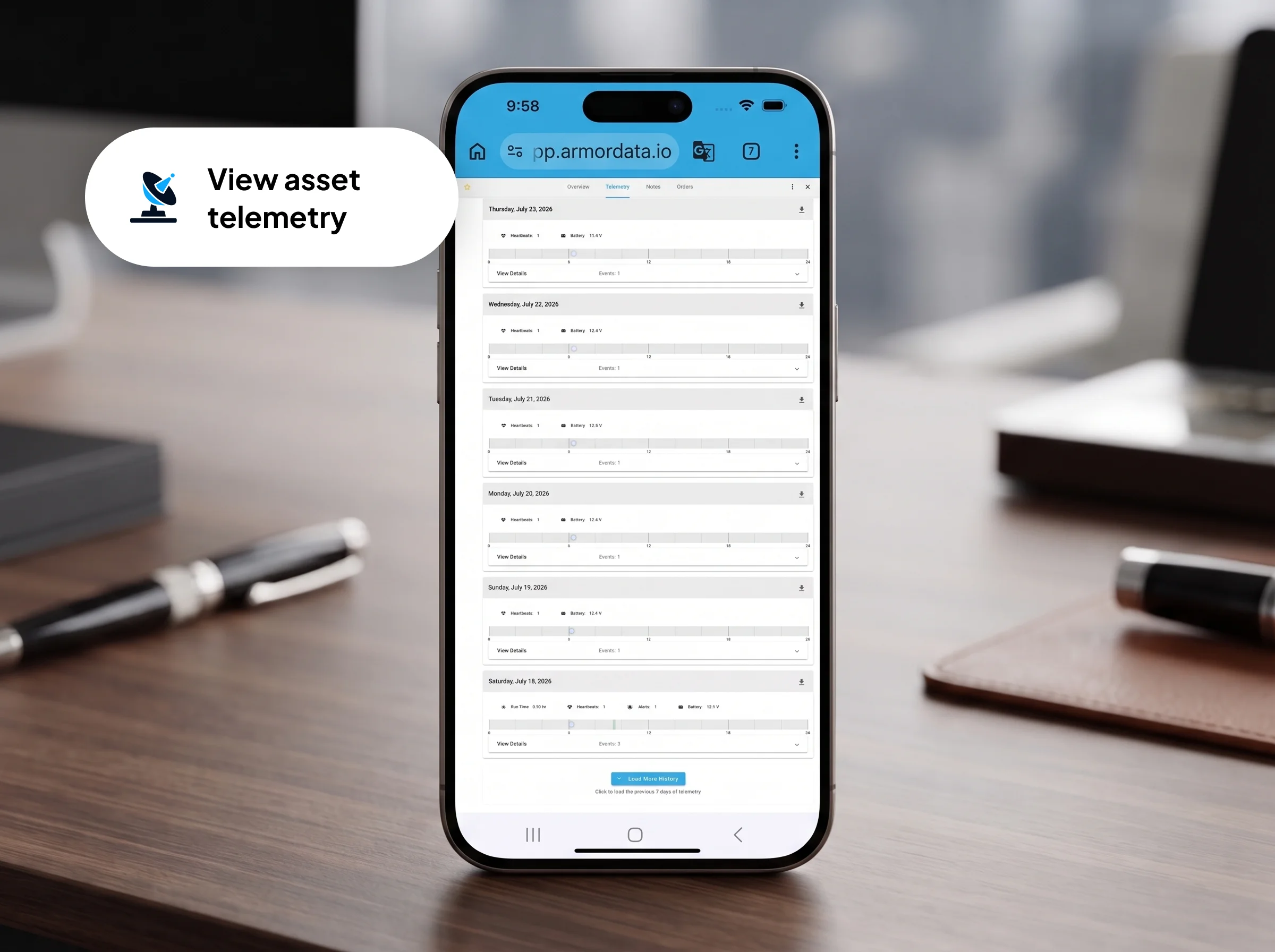 Smartphone displaying the asset telemetry page from the ARMOR™ mobile web app on a desk.