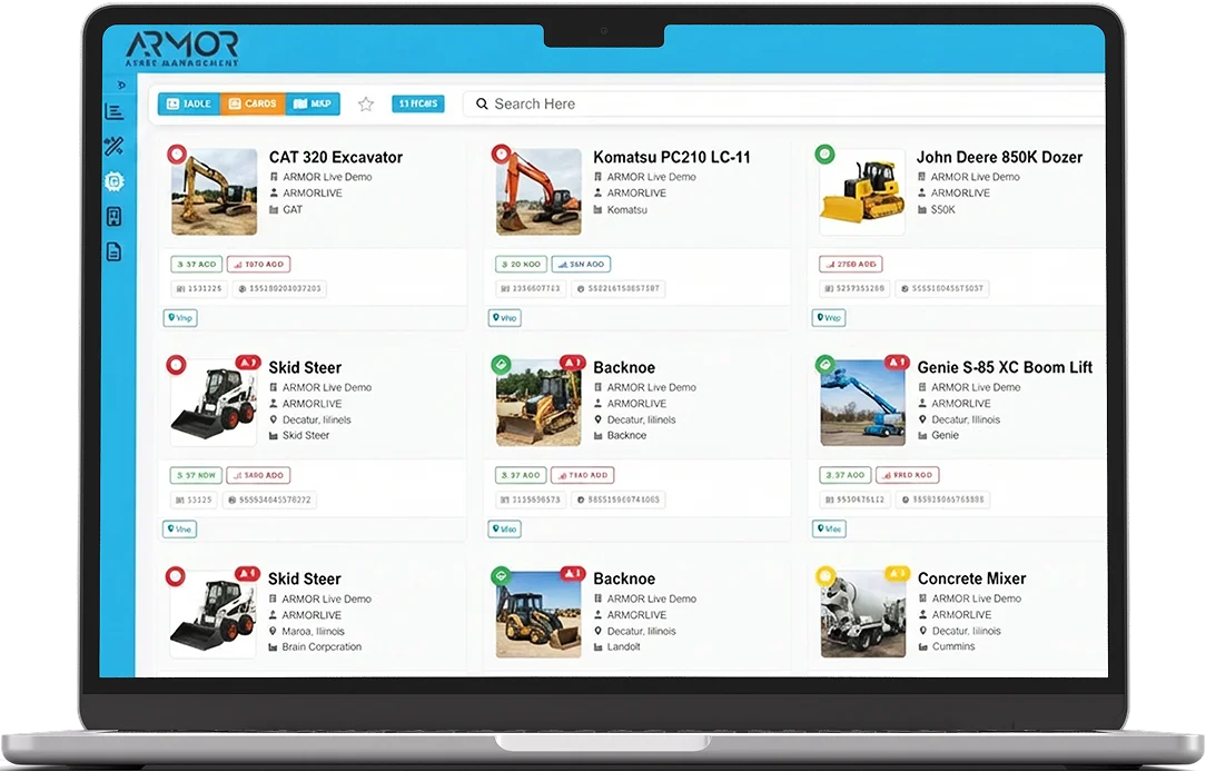 Laptop screen displaying the ARMOR Asset Central™ dashboard interface with heavy equipment inventory cards.