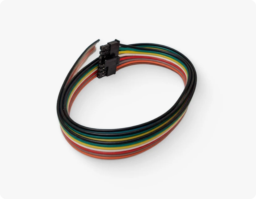 A coiled, multicolored cable with a black connector at one end, representing the flexible and adaptable nature of the ARMOR™