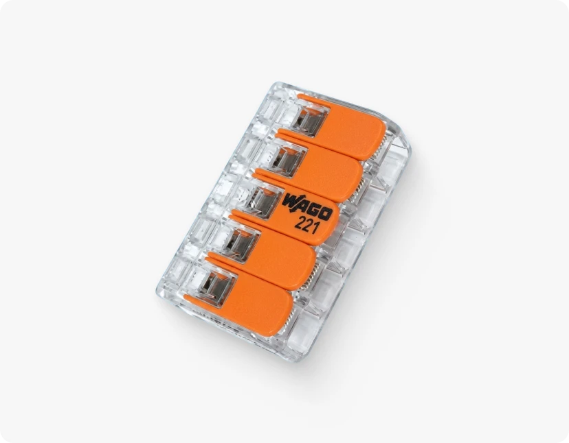 ARMOR™ A small, rectangular, transparent, and orange-colored electrical connector