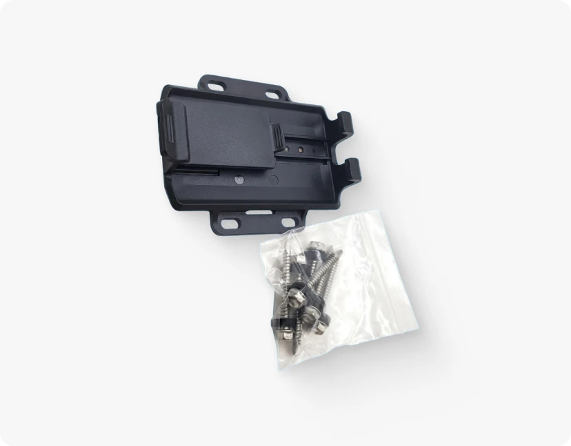 ARMOR™ A black plastic component with a small metal clip and a bag of screws, both on a white background
