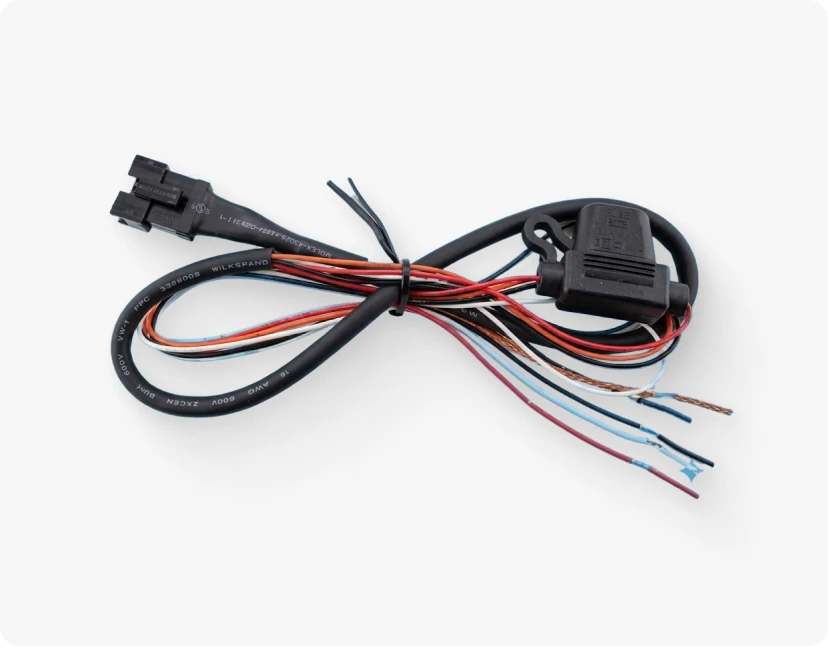 ARMOR™ A black, coiled, multi-colored cable with a black connector on one end and a black, rectangular, flat connector on