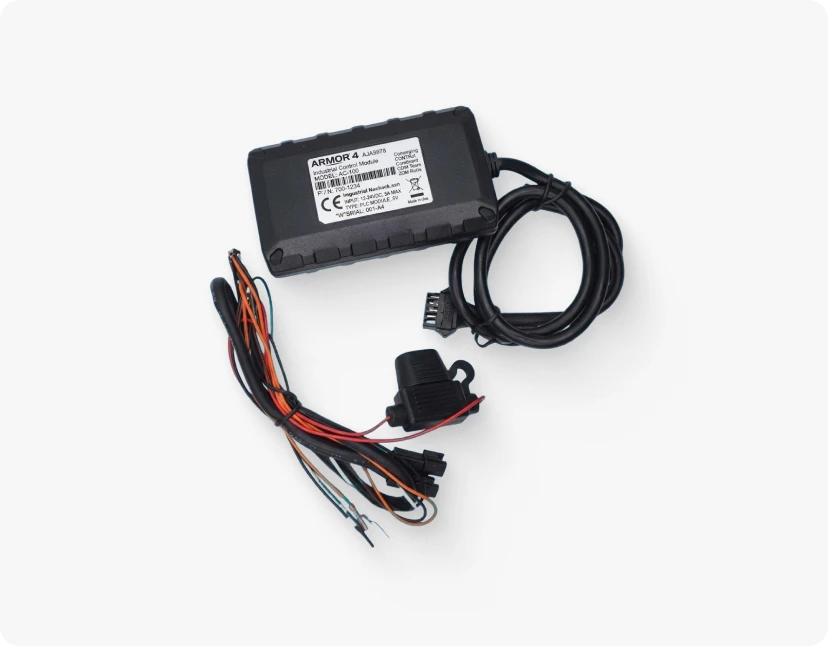 ARMOR 4™ Industrial Control Module (Model AC-100) with connected wiring harness, inline fuse holder, and multi-wire cable assembly.