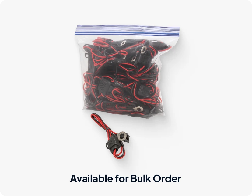 Bulk zippered plastic bag packed with fused wiring harnesses with ring terminals, accompanied by a loose sample harness in front, labeled "Available for Bulk Order".