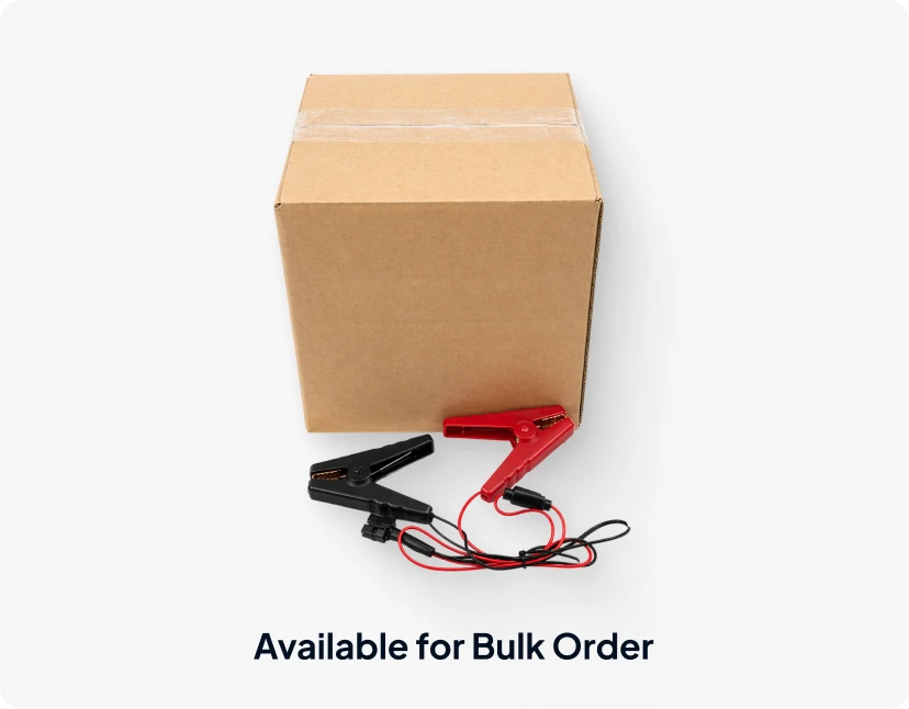 ARMOR™ A cardboard box with a pair of clamps and a cord