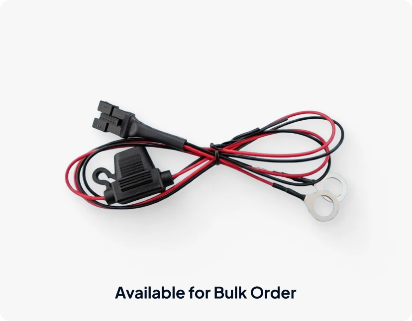 A bundle of red and black wires with a black connector, representing the ARMOR™ product