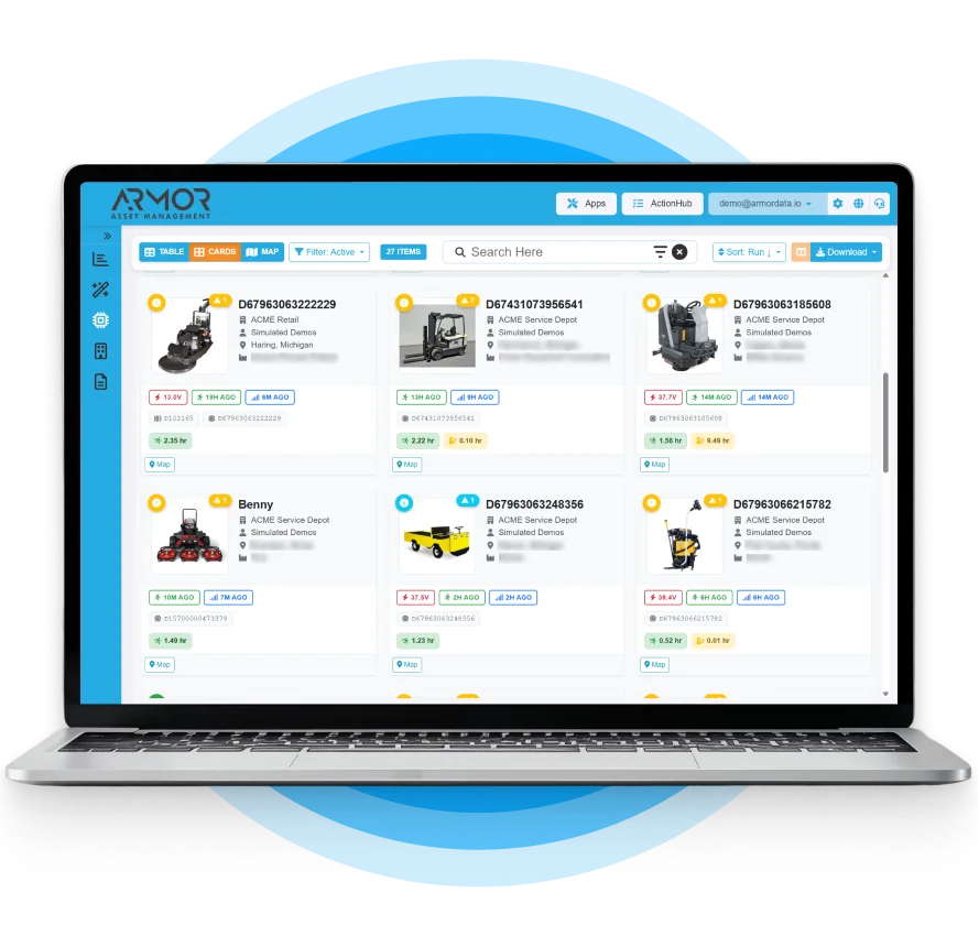 ARMOR Asset Central dashboard on a laptop displaying a card view of tracked equipment including forklifts and floor scrubbers with runtime and location data.