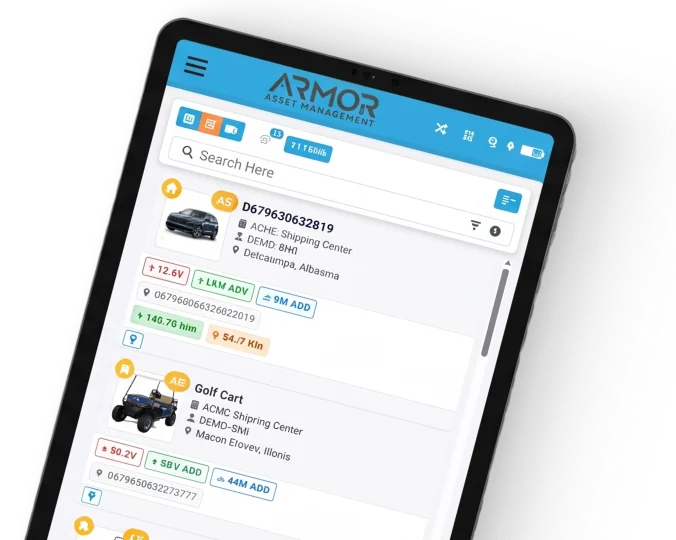 ARMOR Asset Management app displaying a searchable asset list with a car and golf cart, showing location, battery voltage, and shipping center details on a tablet.